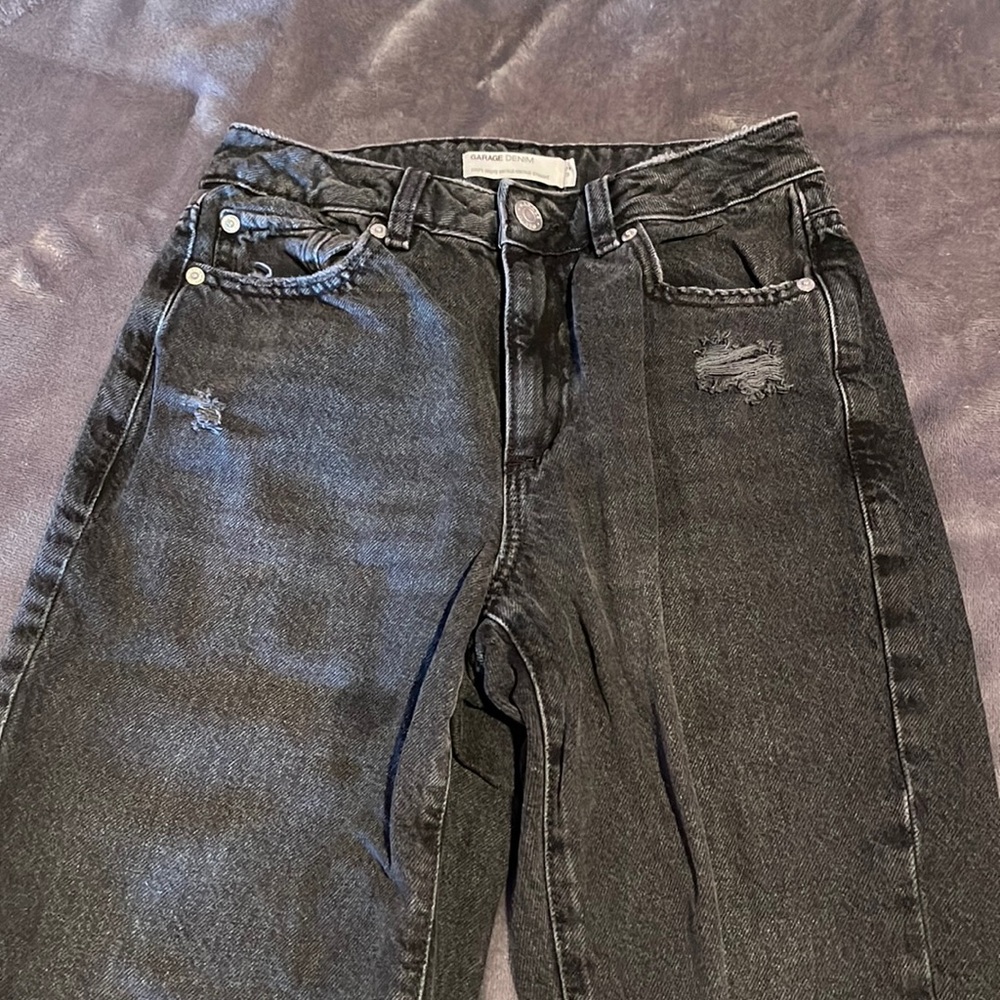 Washed black jeans with rips